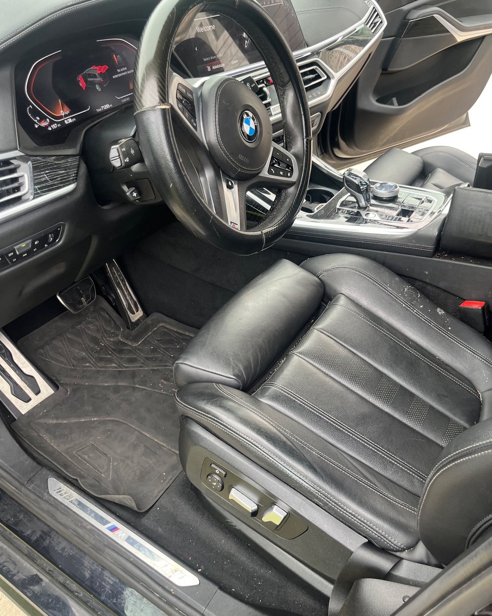 Leather seat and floor mat after the vacuum by Alum Auto Detailing, Westerville