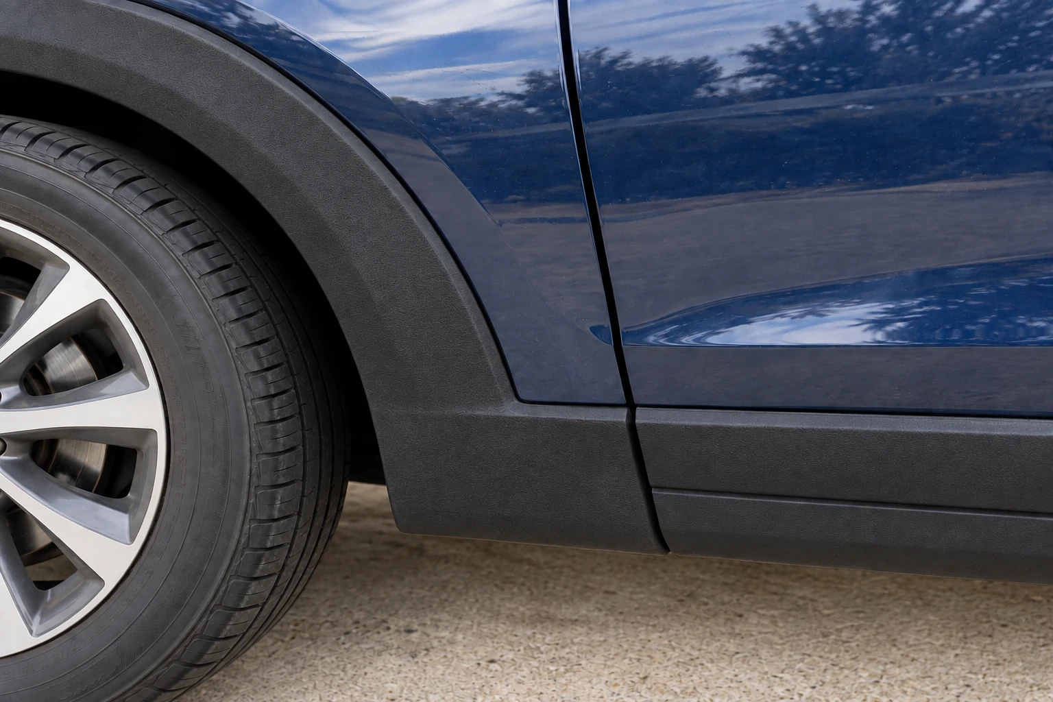 Wheel-arch trim comparison illustration showing the restored side
